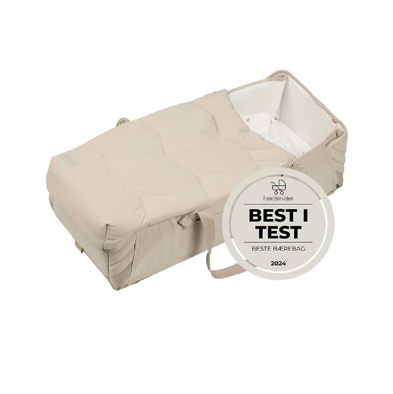 Voksi Carry Me babynest i farven Seashell Sand Cream