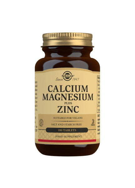 Glas med Solgar Calcium Magnesium Plus Zink, 100 tabletter